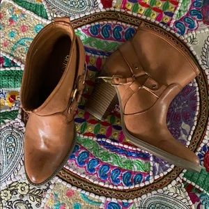 Brown booties with gold spurs